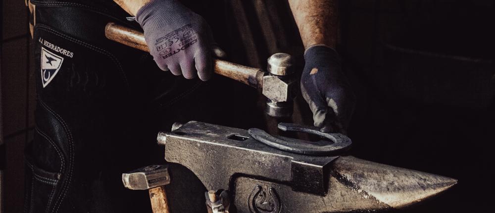 Farrier Preparing Horse Shoe