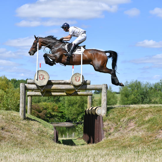 Harry Meade Jumping Cross Country Fence